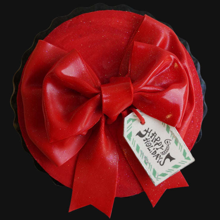 Overhead view of the red Bow Cake by Cades Cakes