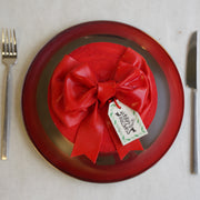 Overhead view of the red Bow Cake on a plate by Cades Cakes