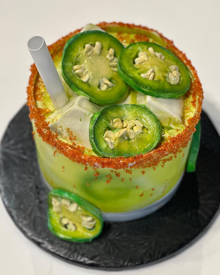 Cake shaped like a spicy margarita with jalapeños on the rocks