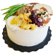 Round Cake with Thanksgiving dinner topping decorations by Cades Cakes