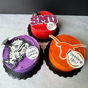Cades Cakes round cakes with different college logos