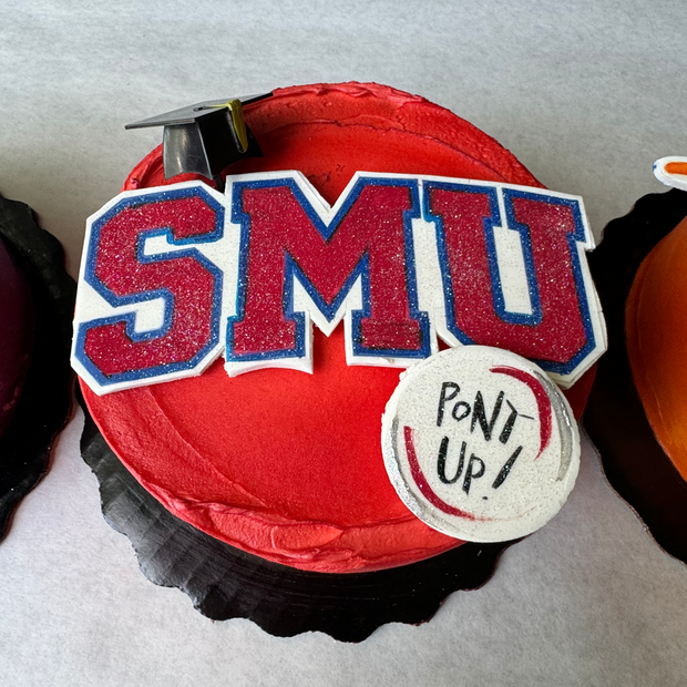 Cades Cakes round cake with Texas University graduation theme